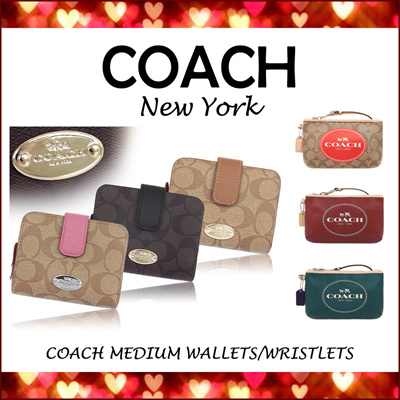 coach wristlets 100