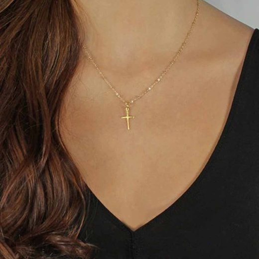 a gold chain with a cross